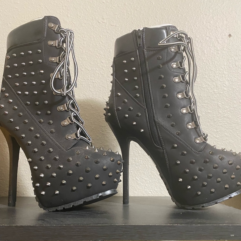 Black high heel boots. Never worn. The spikes are sharp.